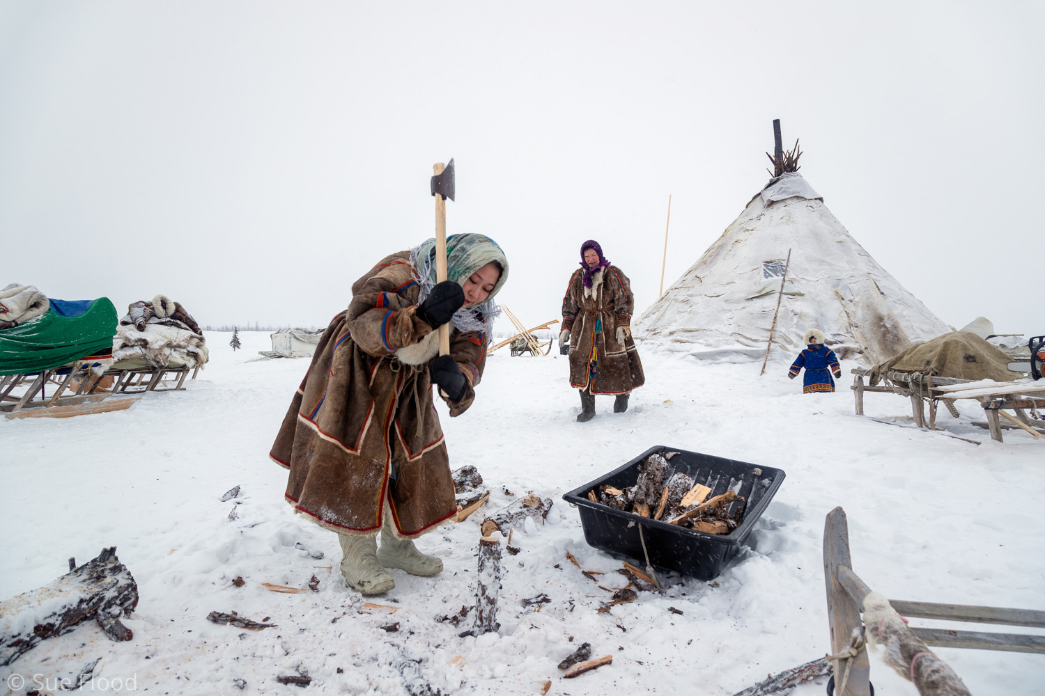 Nenets women chopping wood, Yamal peninsula, Siberia